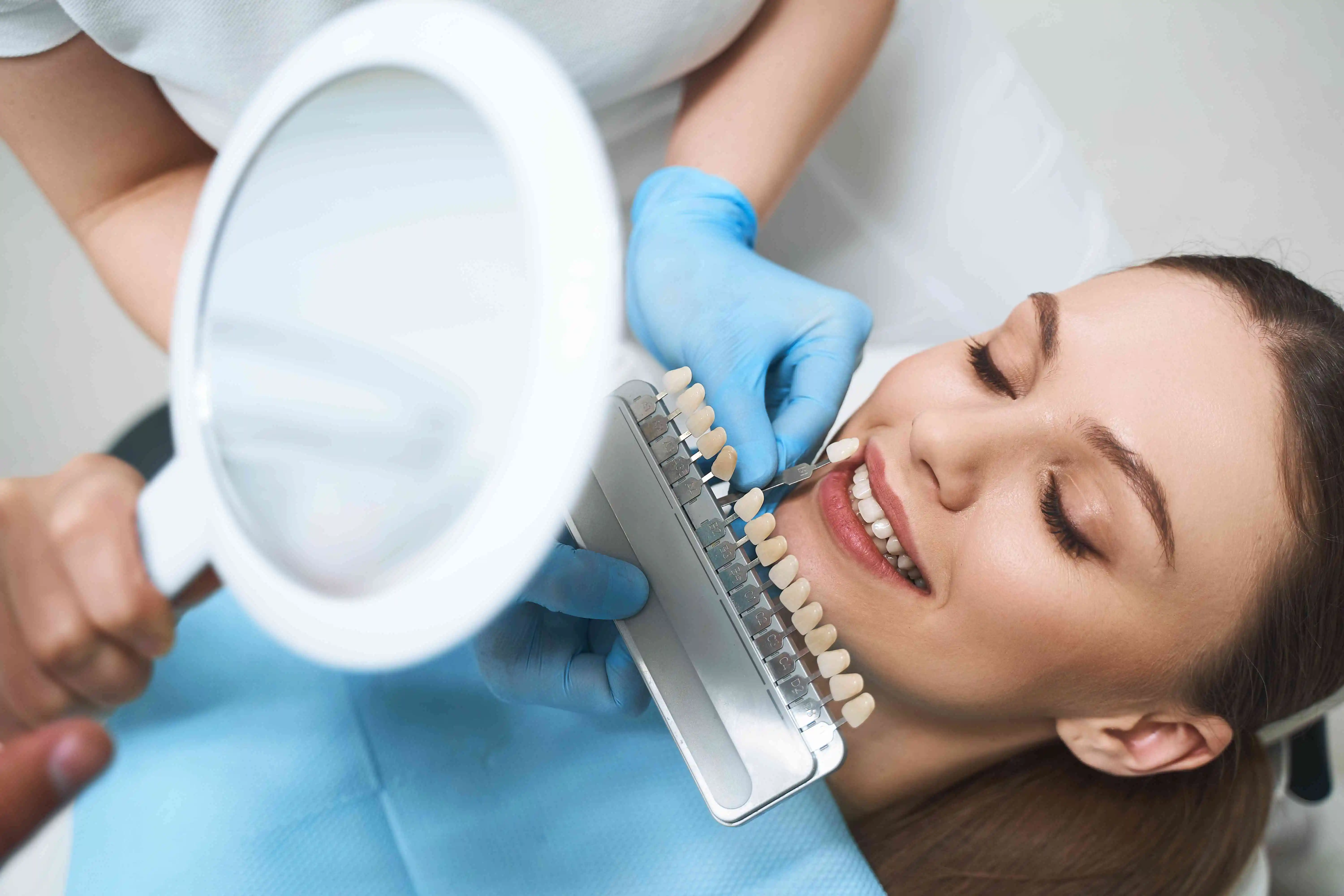 young girl in dentist office with veneer