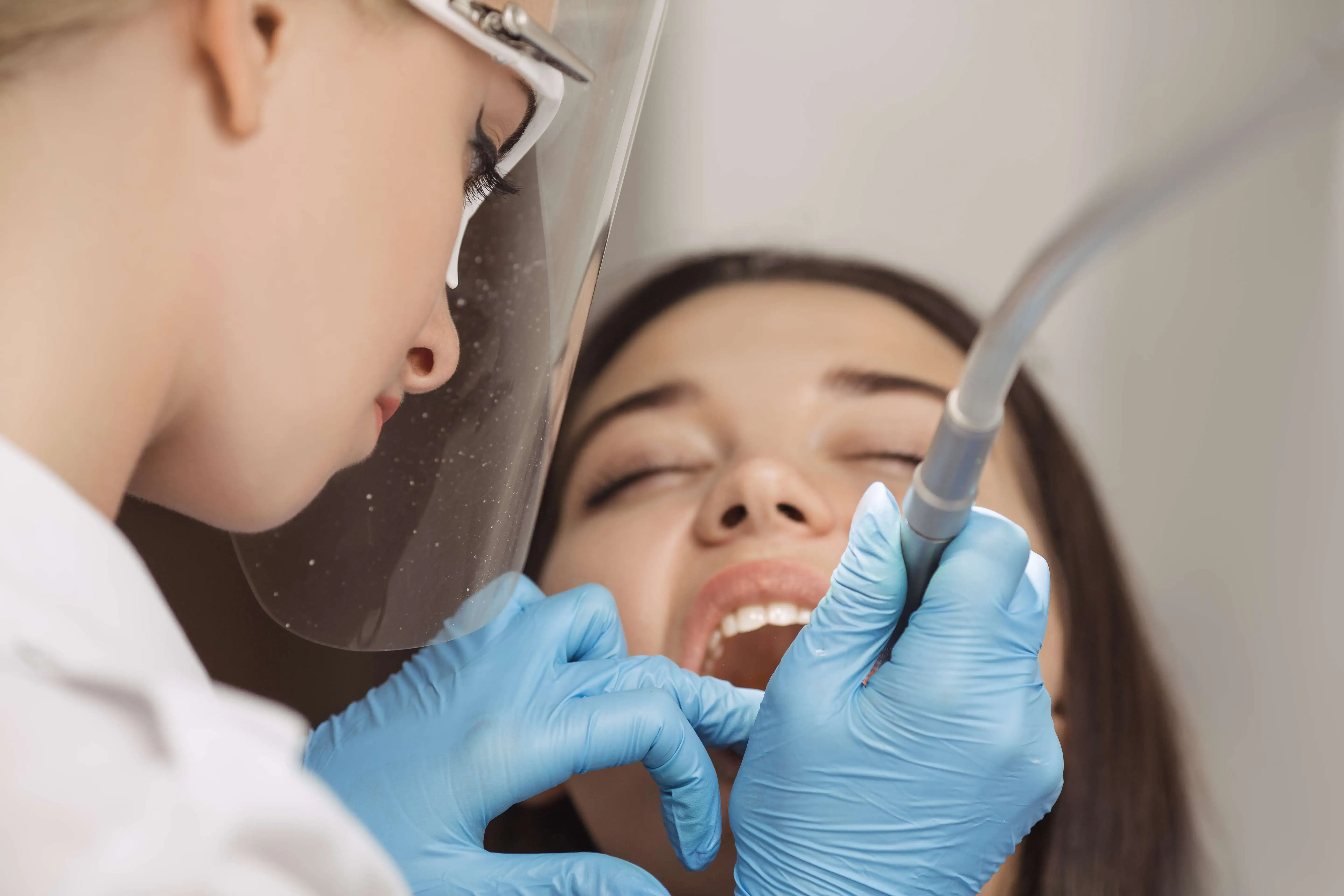 dentist doing a Dental bonding Procedures